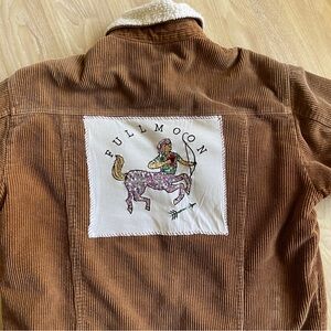 Brown corduroy jacket with centaur patch